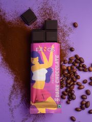 Four vibrant Fancis chocolate packages (Milk Chocolate, Merry Mango, Rich Chocolate, and Fruit & Nut) on a cocoa powder surface with scattered cocoa beans.